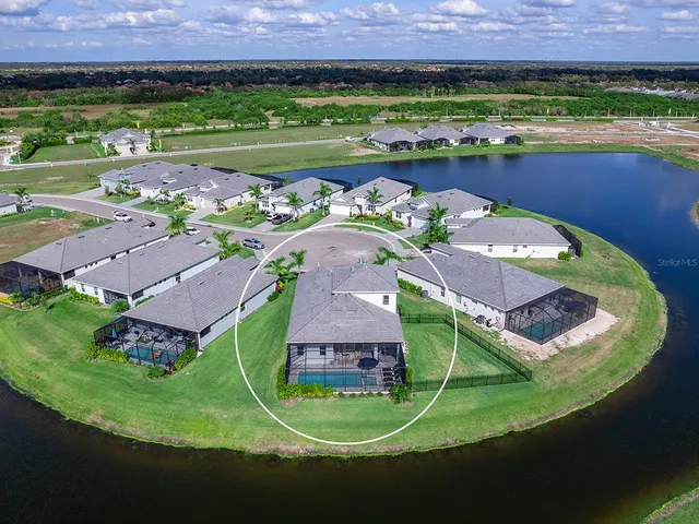 a living room with furniture and a mirror