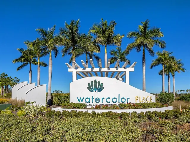a living room with furniture a chandelier and a flat screen tv
