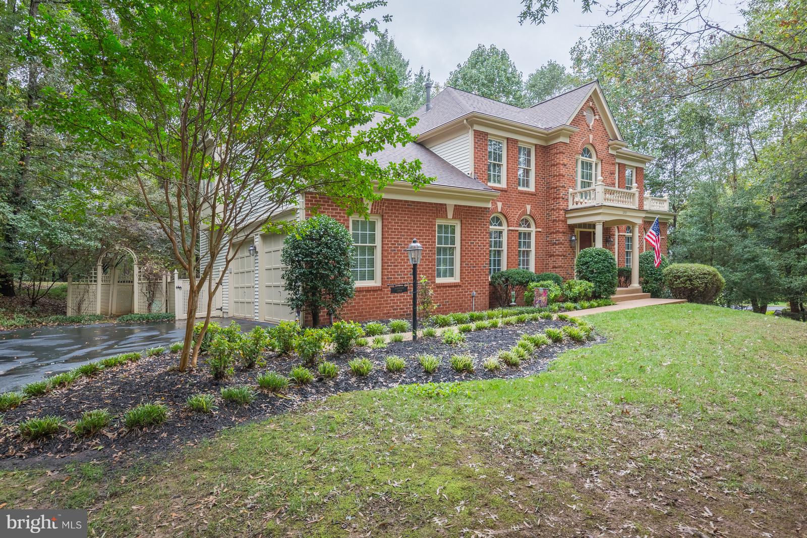 12101 Coloriver Road Manassas, VA 20112 - Photo 1 of 30 a front view of a house with a yard and green space