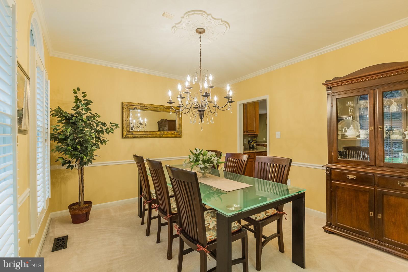 12101 Coloriver Road Manassas, VA 20112 - Photo 14 of 30 a view of a dining room with furniture and chandelier