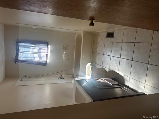 542 Post Avenue Bellport, NY 11713 - Photo 16 of 38 a bathroom with a sink a toilet and a shower