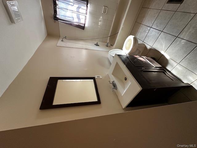 542 Post Avenue Bellport, NY 11713 - Photo 17 of 38 a bathroom with a toilet sink and mirror