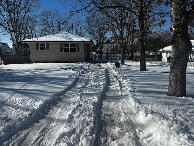542 Post Avenue Bellport, NY 11713 - Photo 4 of 38 a front view of a house with a yard