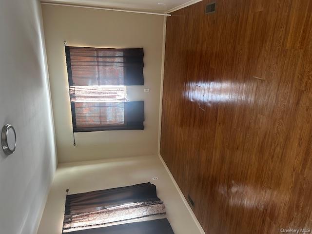 542 Post Avenue Bellport, NY 11713 - Photo 7 of 38 a view of empty room with wooden floor and fan