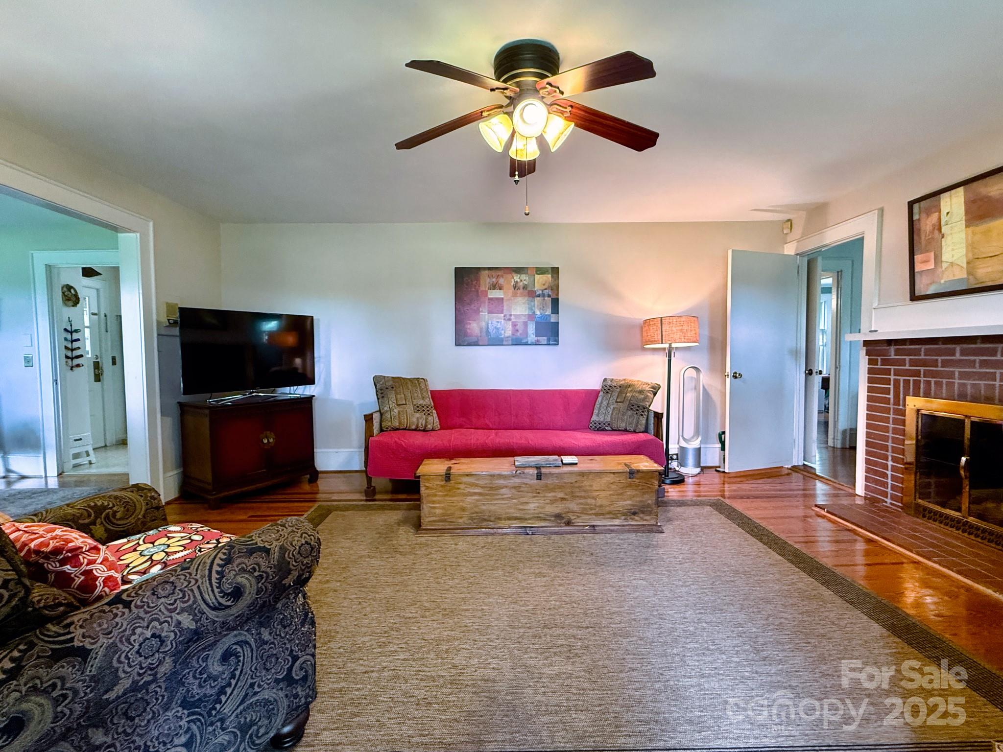 1441 Cove Road Rutherfordton, NC 28139 - Photo 13 of 36 a living room with furniture and a flat screen tv