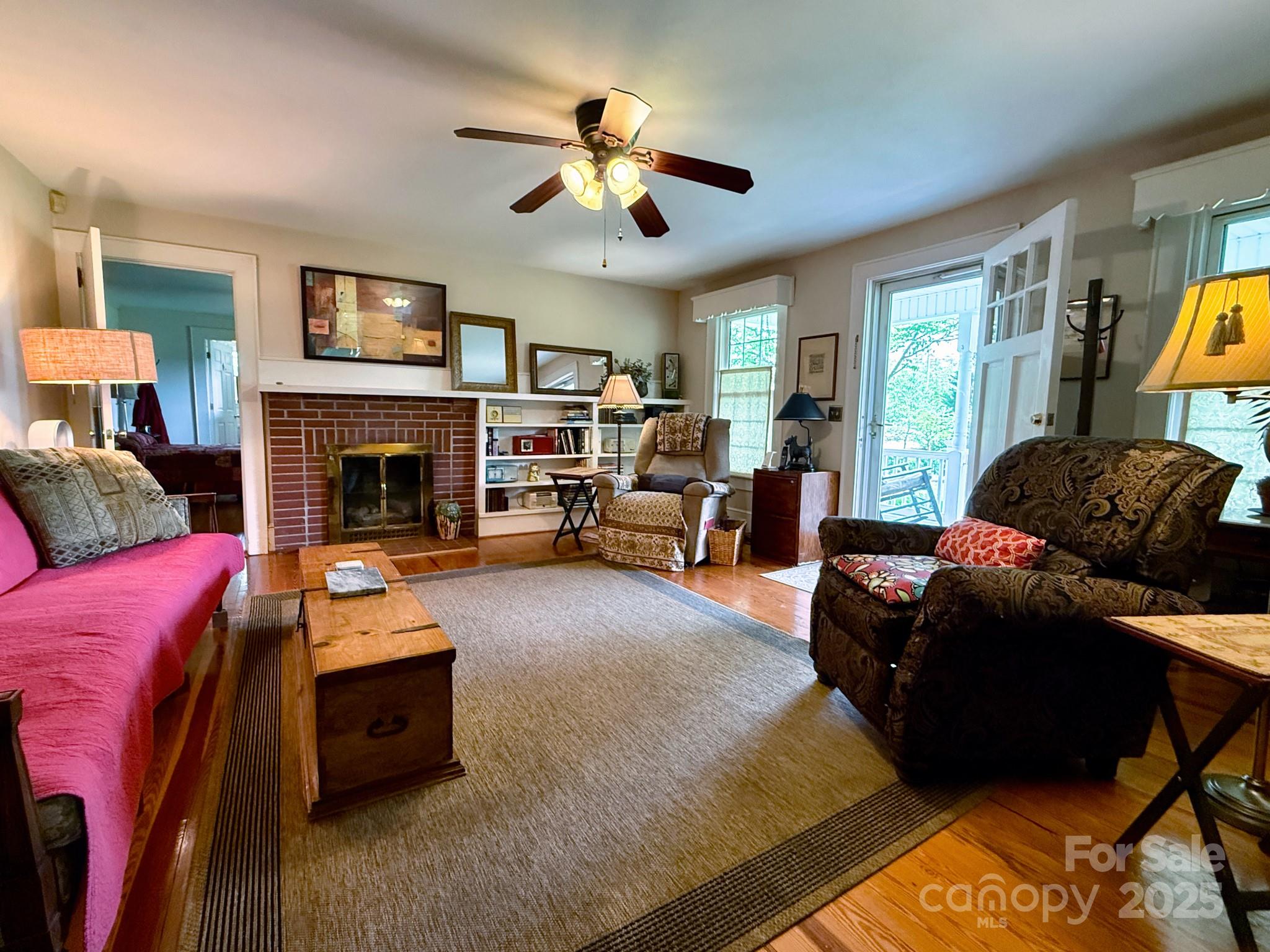 1441 Cove Road Rutherfordton, NC 28139 - Photo 15 of 36 a living room with furniture and a fireplace