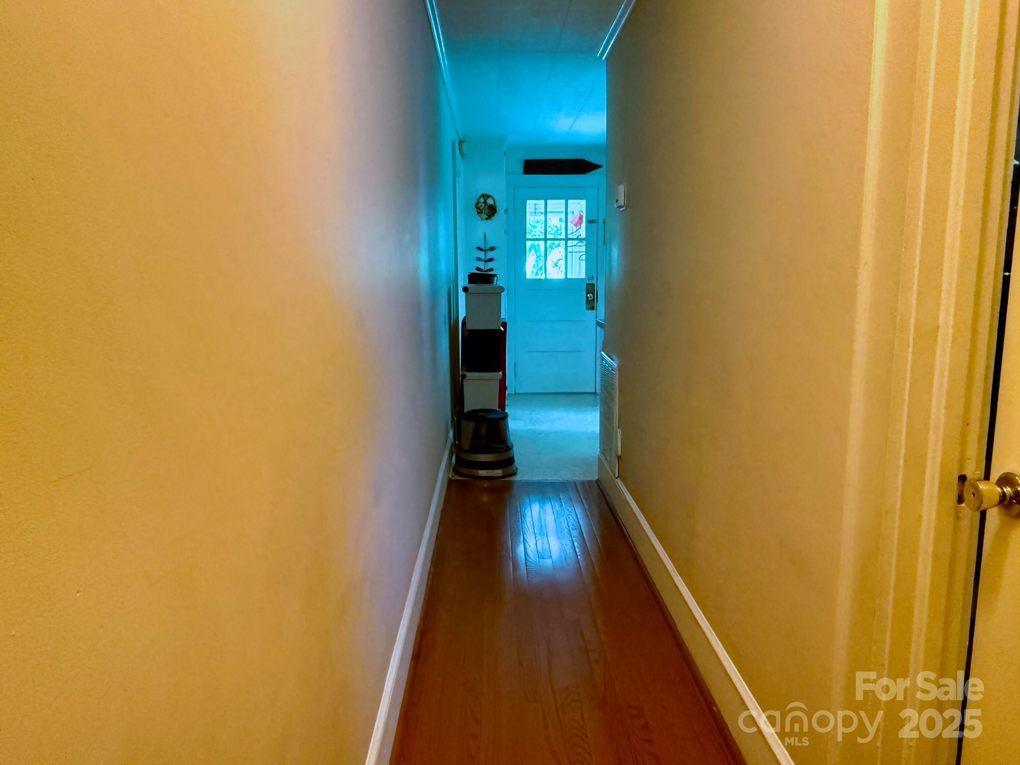 1441 Cove Road Rutherfordton, NC 28139 - Photo 22 of 36 a view of a hallway with wooden floor and a bathroom