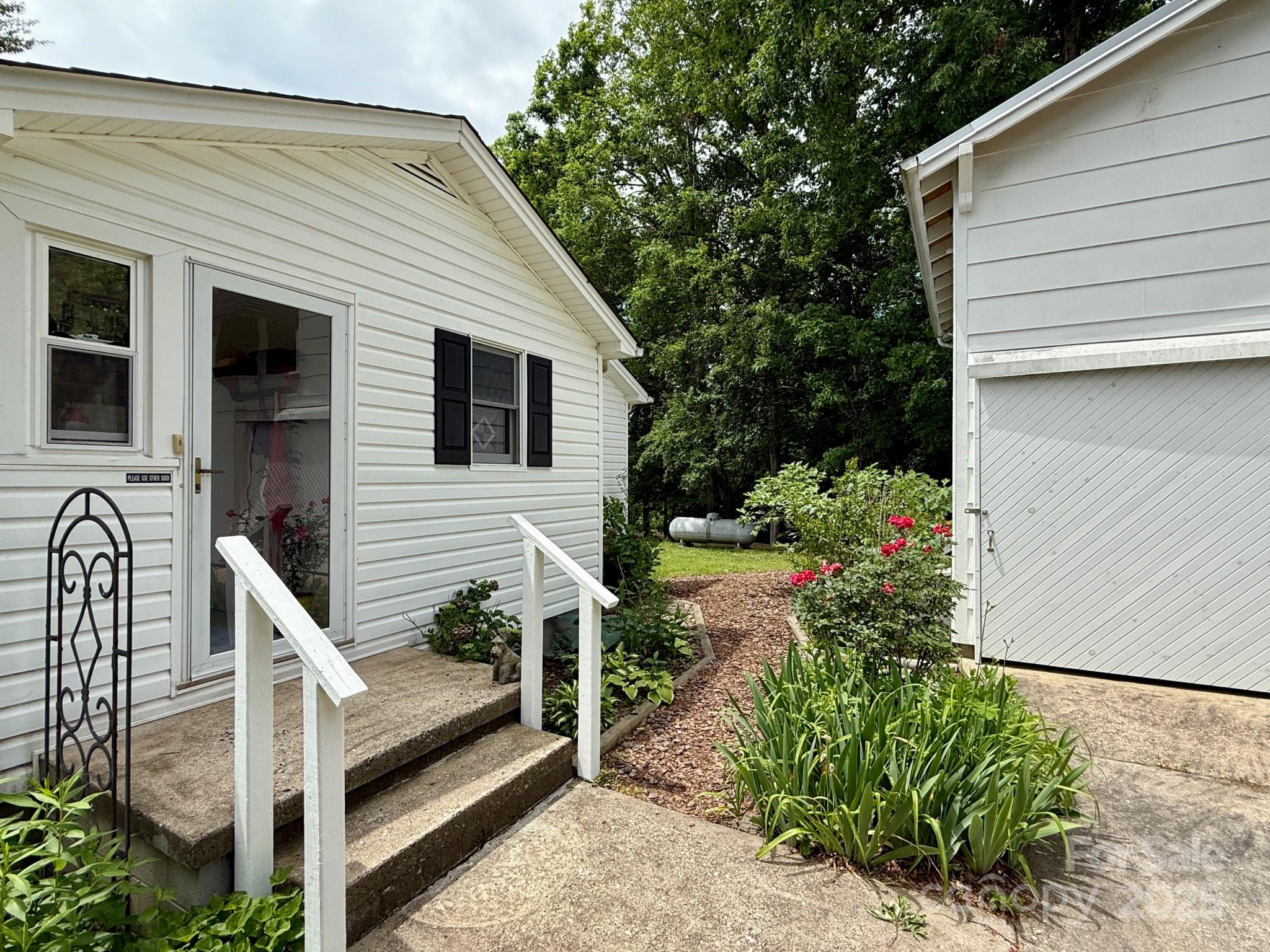 1441 Cove Road Rutherfordton, NC 28139 - Photo 24 of 36 a view of a house with backyard and sitting area