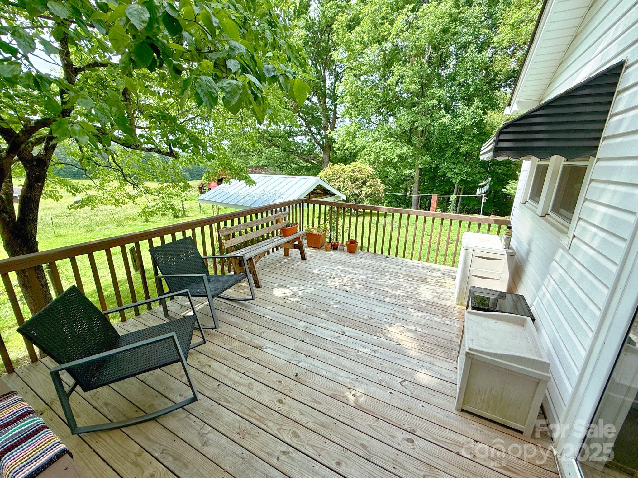 1441 Cove Road Rutherfordton, NC 28139 - Photo 25 of 36 a view of a wooden deck with a bench