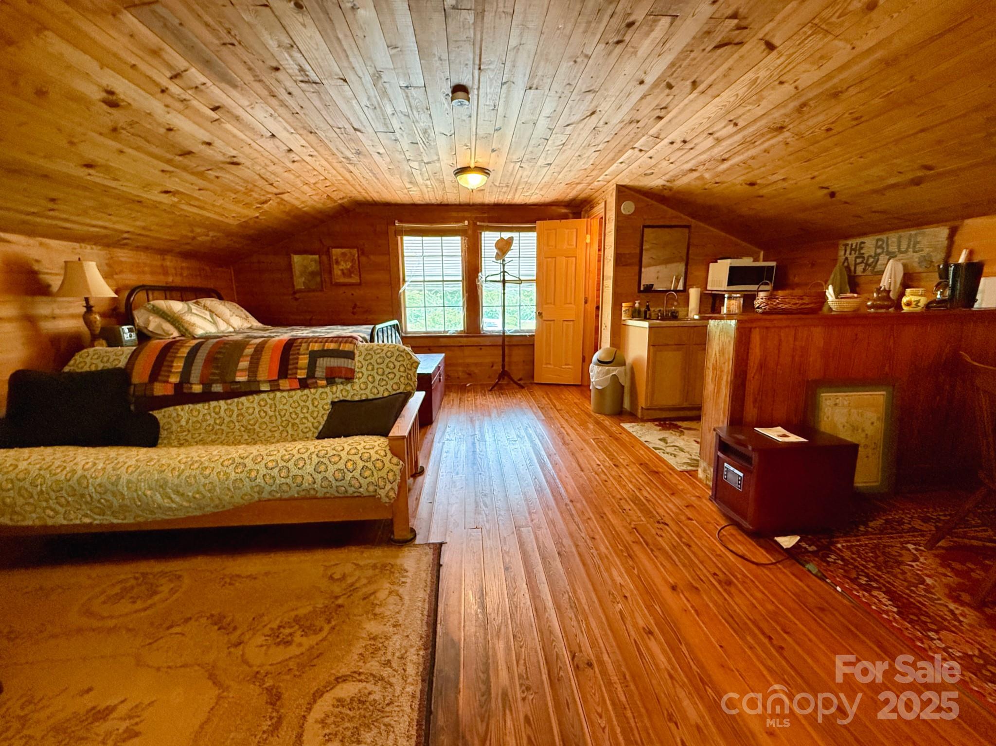 1441 Cove Road Rutherfordton, NC 28139 - Photo 28 of 36 a living room with furniture and wooden floors