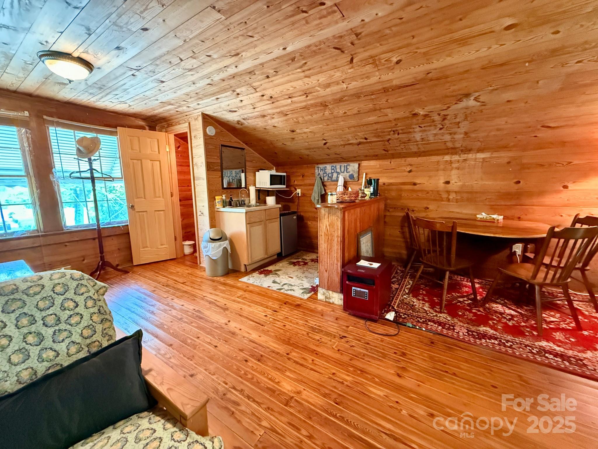 1441 Cove Road Rutherfordton, NC 28139 - Photo 29 of 36 a bedroom with furniture and wooden floor