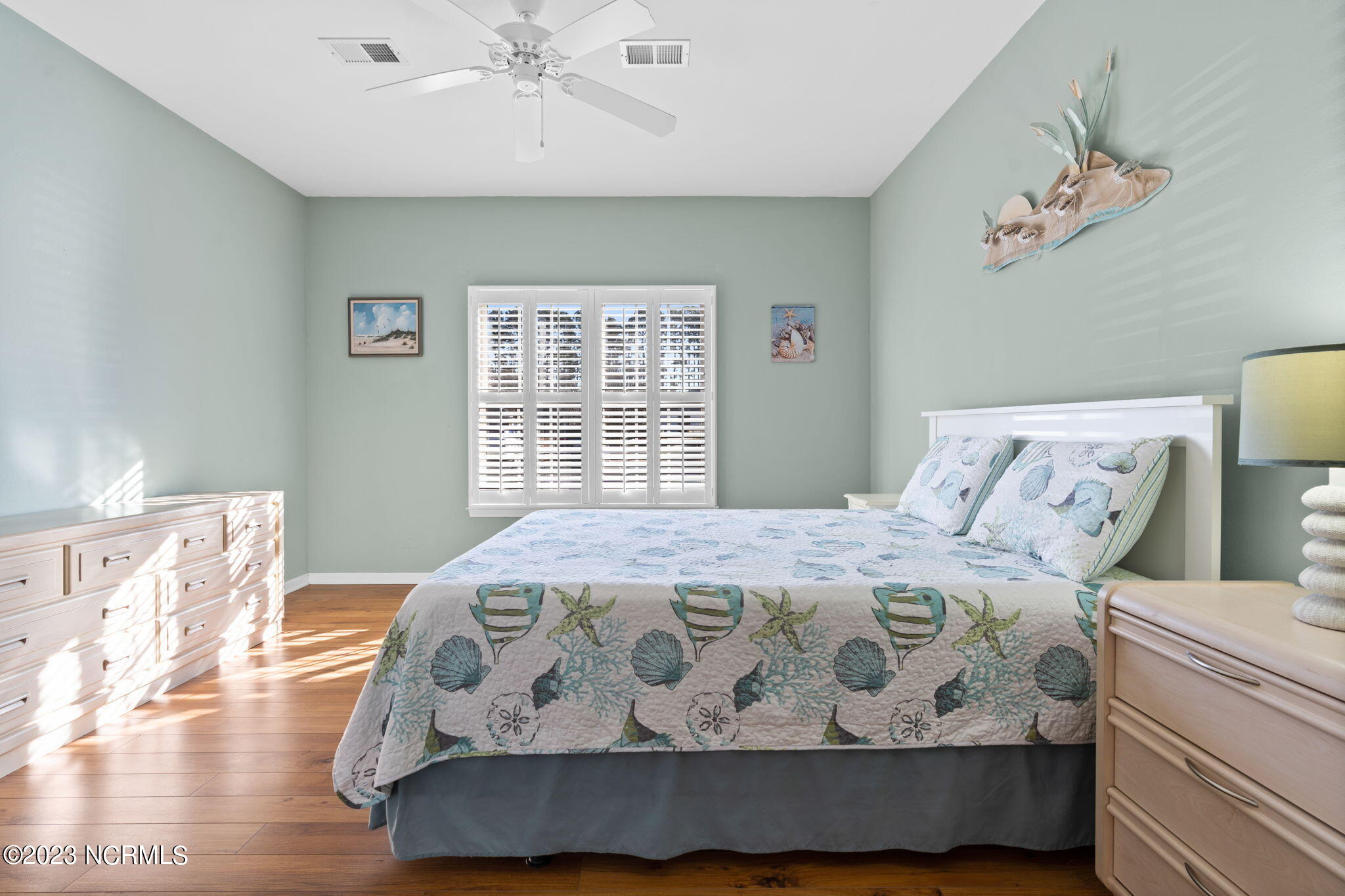 126 Rice Mill Circle, Unit 2 Sunset Beach, NC 28468 - Photo 30 of 90 Bedroom 2 with plantation shutters