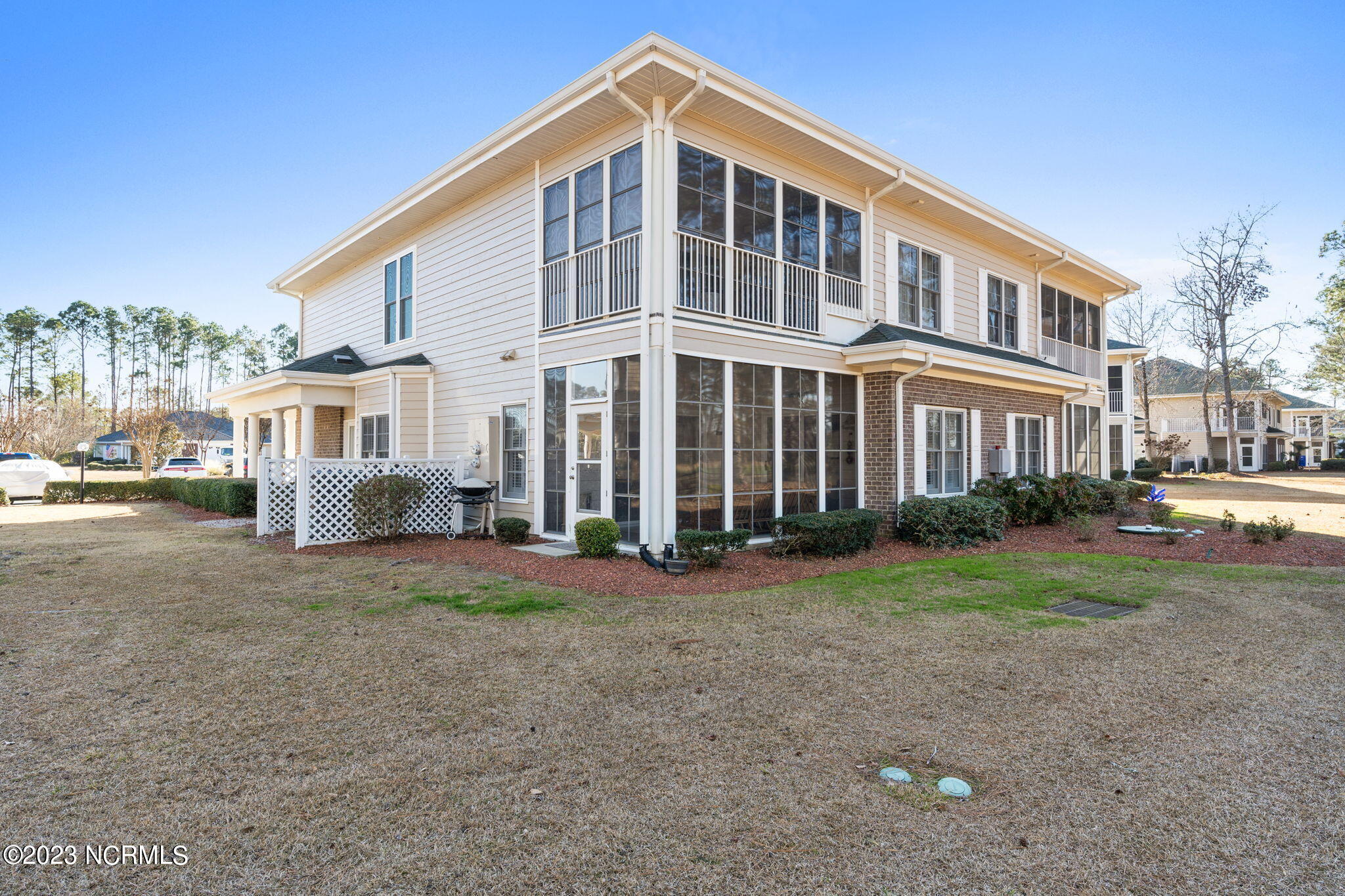 126 Rice Mill Circle, Unit 2 Sunset Beach, NC 28468 - Photo 44 of 90 Rear elevation