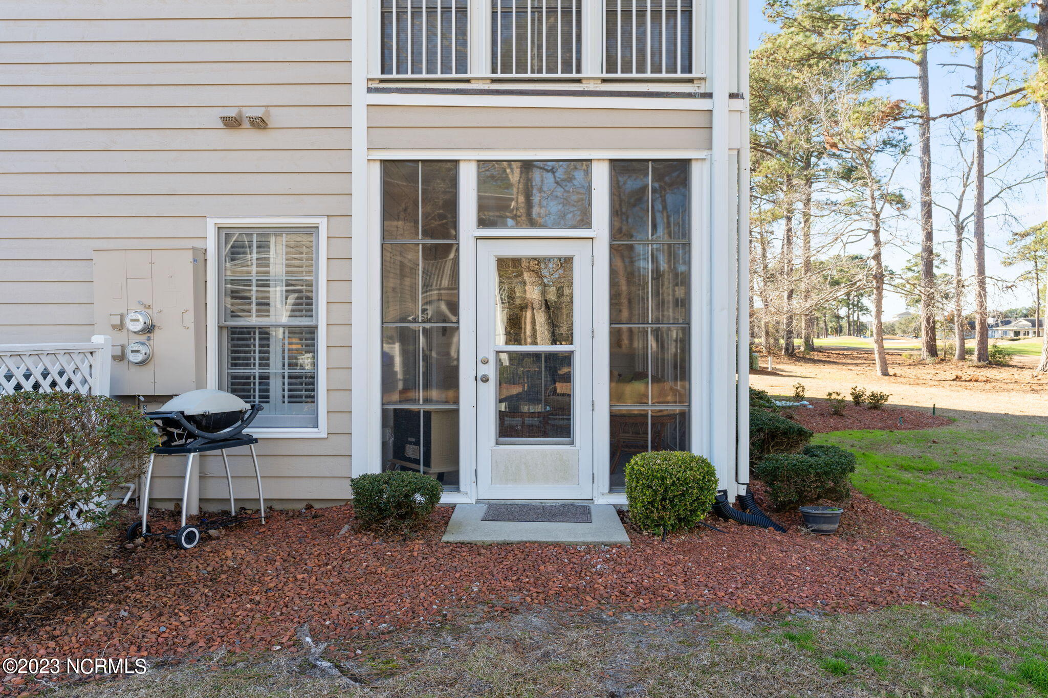 126 Rice Mill Circle, Unit 2 Sunset Beach, NC 28468 - Photo 45 of 90 Side elevation with access to sunroom