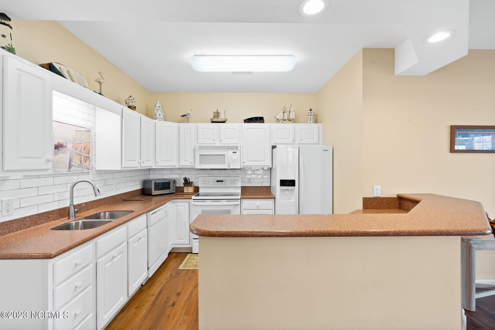 126 Rice Mill Circle, Unit 2 Sunset Beach, NC 28468 - Photo 10 of 90 Kitchen with solid countertop