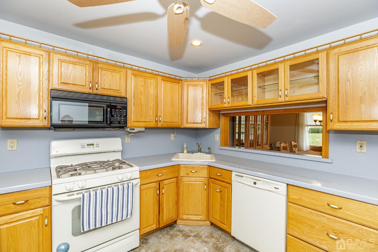 55 Old Post Road Edison, NJ 08817 - Photo 14 of 53 a kitchen with stainless steel appliances granite countertop a stove and a sink