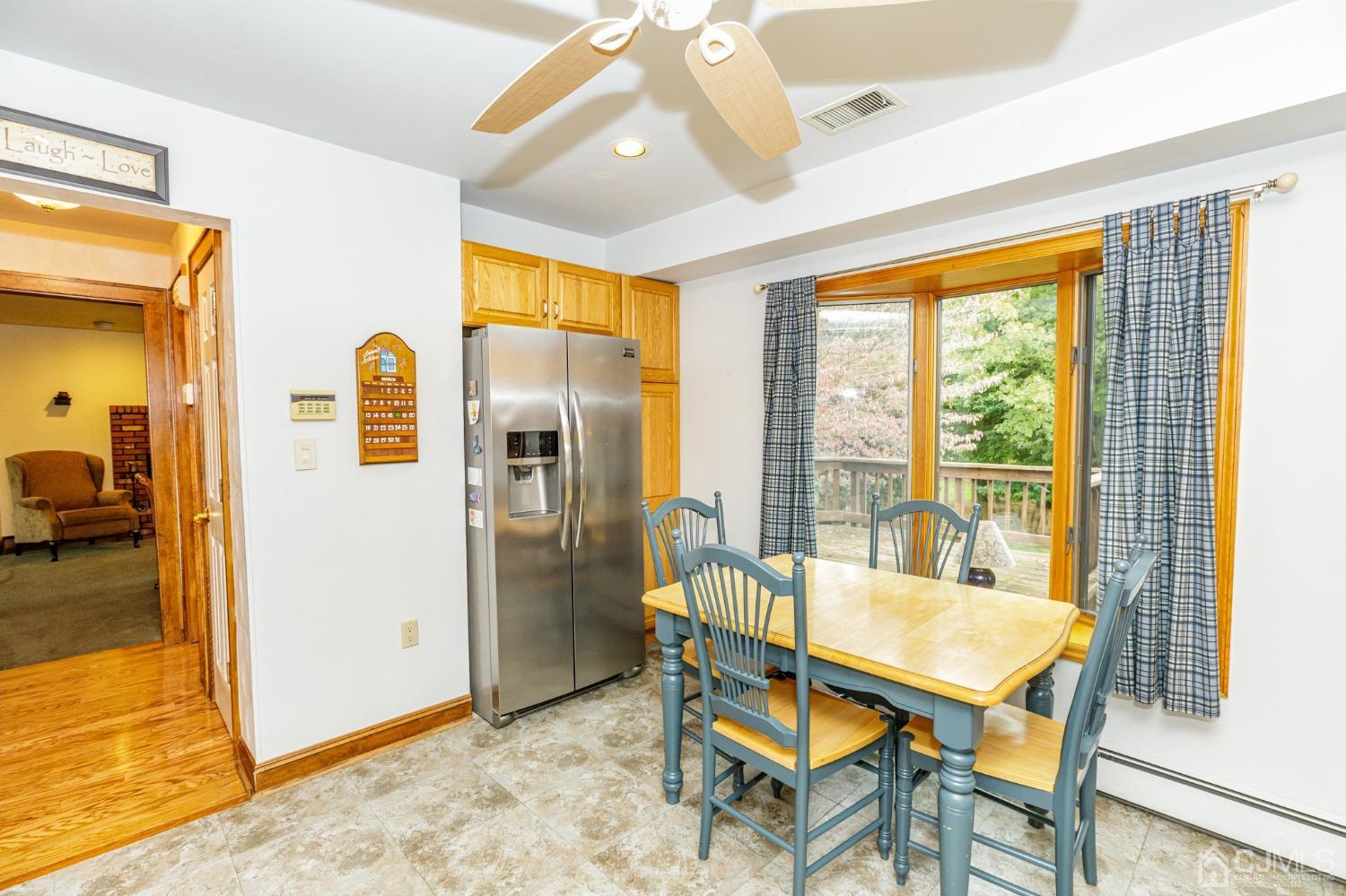 55 Old Post Road Edison, NJ 08817 - Photo 16 of 53 a dining room with furniture and a floor to ceiling window