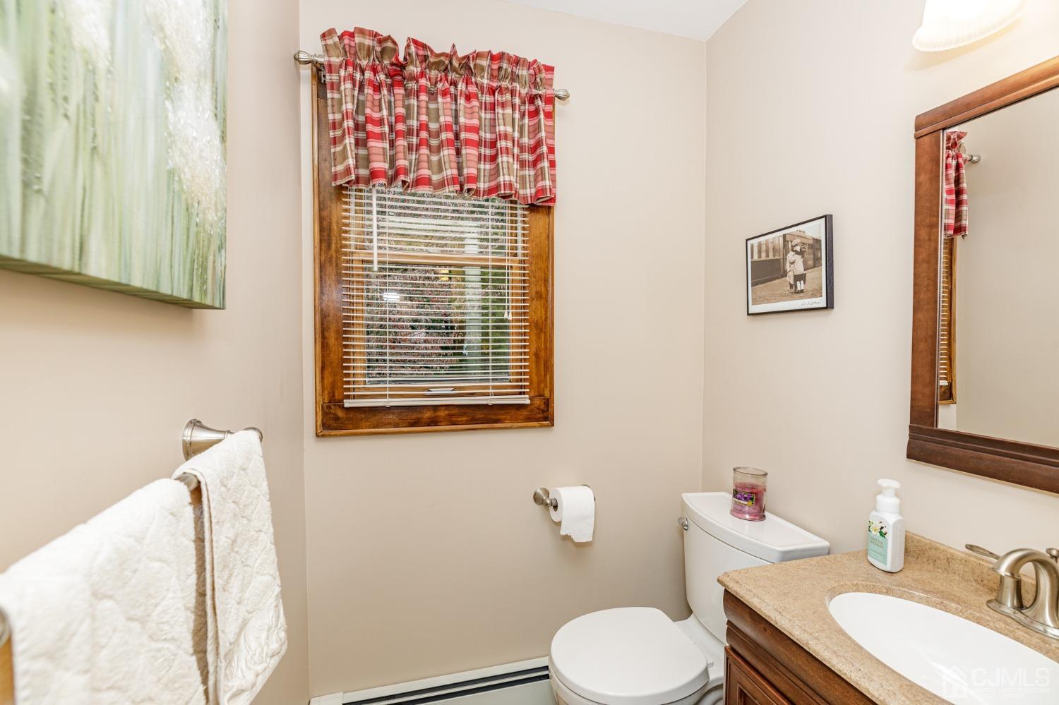 55 Old Post Road Edison, NJ 08817 - Photo 18 of 53 a bathroom with a toilet sink and mirror