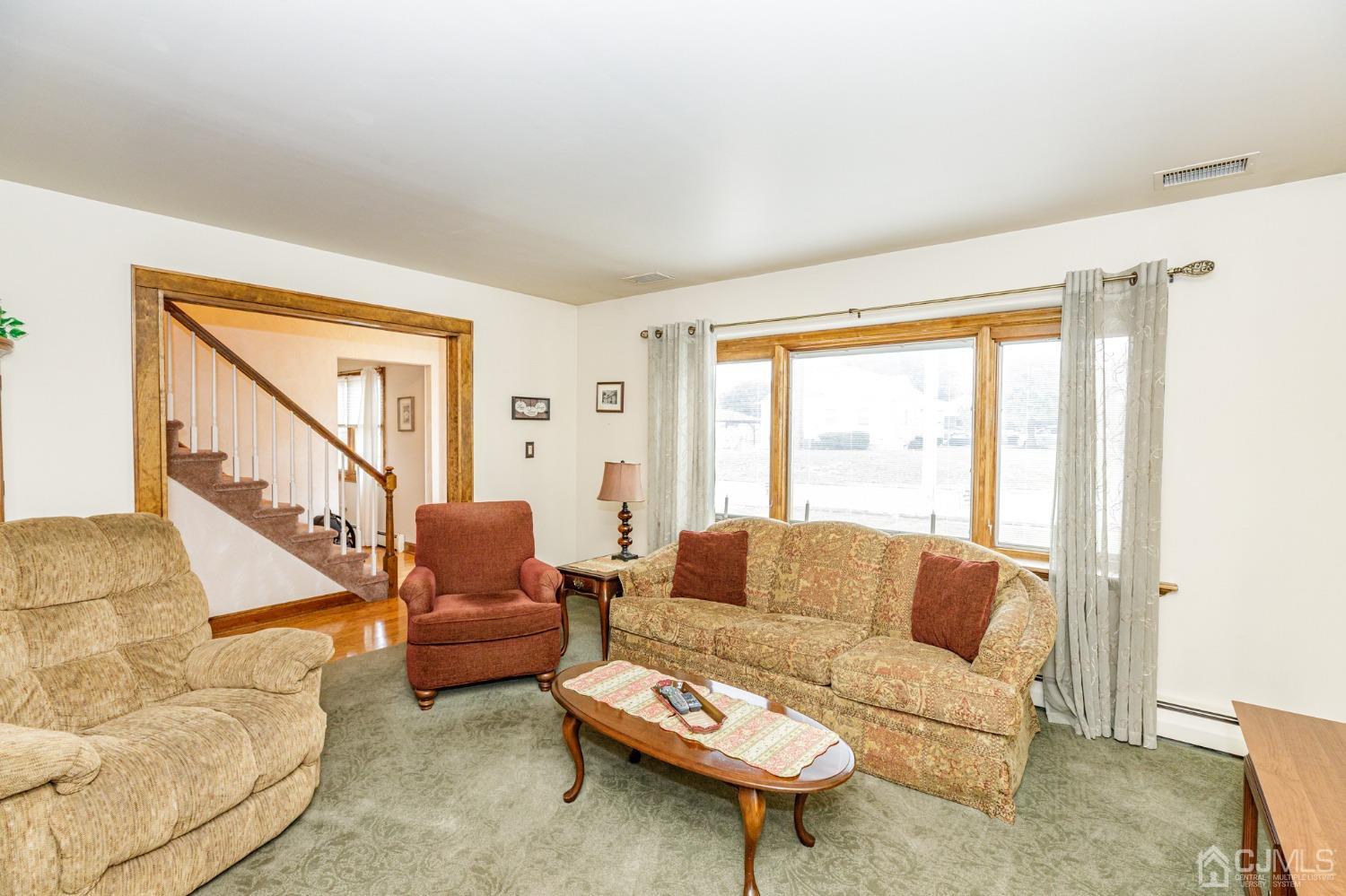55 Old Post Road Edison, NJ 08817 - Photo 2 of 53 a living room with furniture and a large window