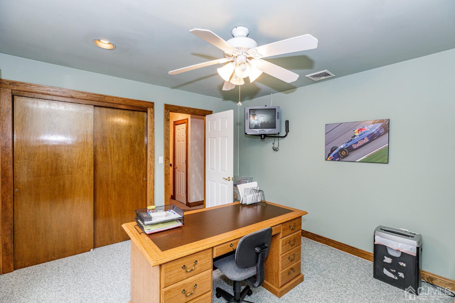 55 Old Post Road Edison, NJ 08817 - Photo 26 of 53 a room with chandelier fan and a wooden floor