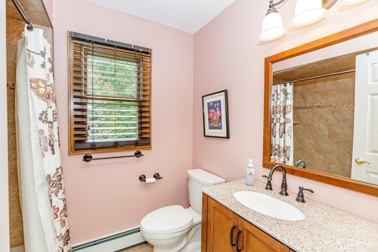 55 Old Post Road Edison, NJ 08817 - Photo 29 of 53 a bathroom with a granite countertop sink and a mirror