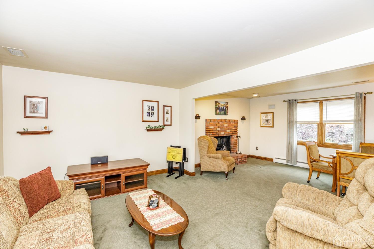 55 Old Post Road Edison, NJ 08817 - Photo 3 of 53 a living room with furniture a rug and a window