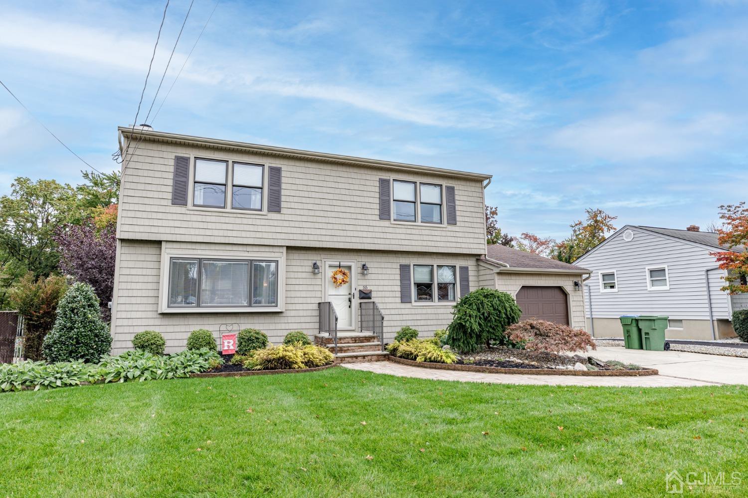 55 Old Post Road Edison, NJ 08817 - Photo 41 of 53 a front view of a house with a yard