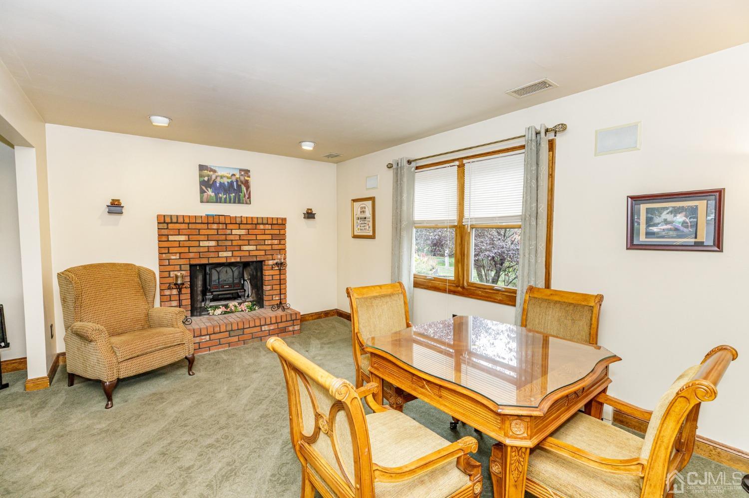 55 Old Post Road Edison, NJ 08817 - Photo 6 of 53 a living room with furniture a fireplace and a large window