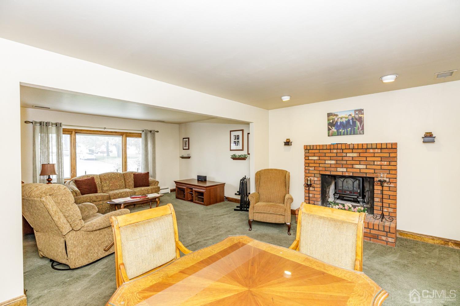 55 Old Post Road Edison, NJ 08817 - Photo 8 of 53 a living room with furniture and a fireplace