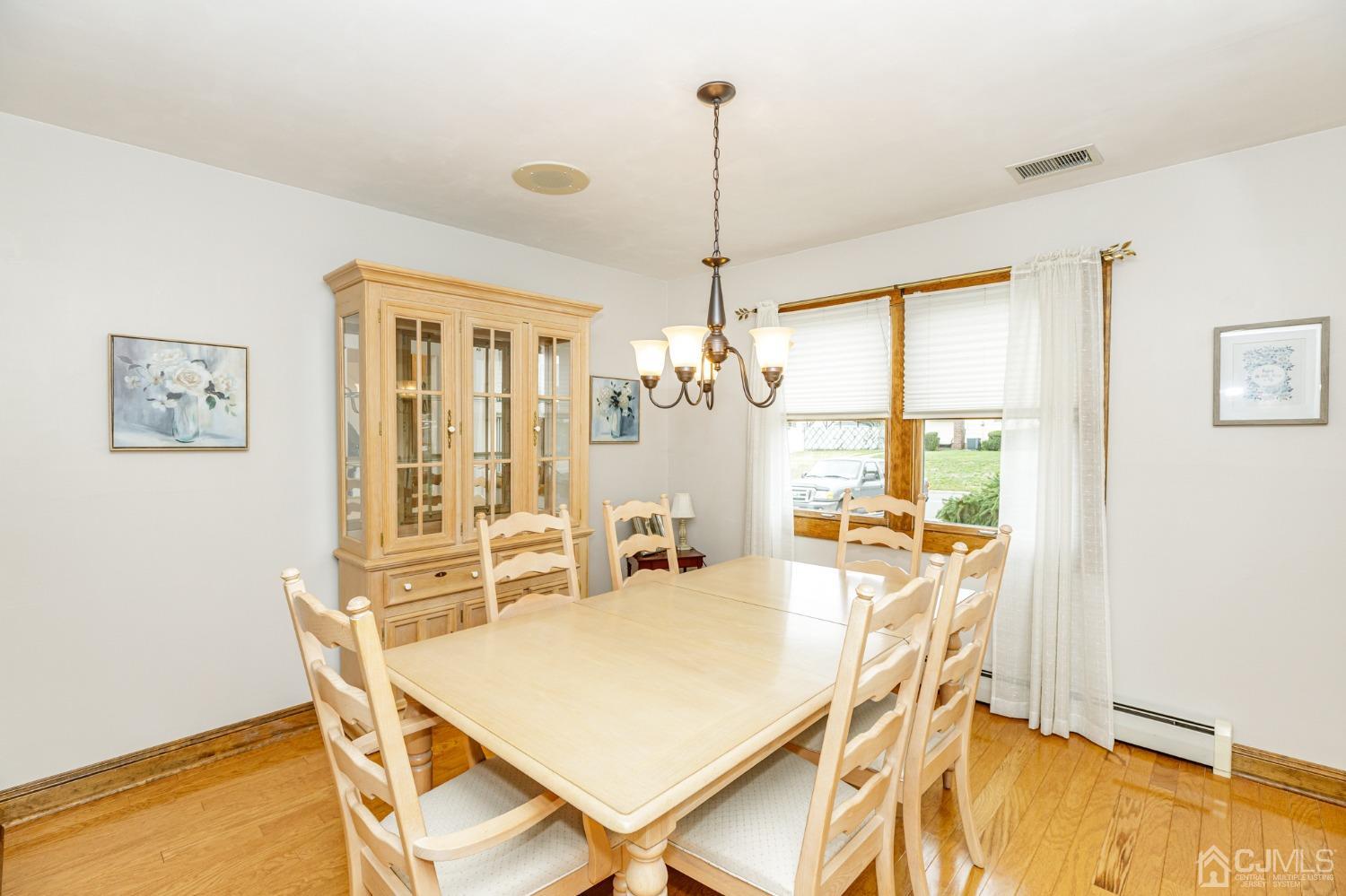 55 Old Post Road Edison, NJ 08817 - Photo 9 of 53 a view of a dining room with furniture and a chandelier