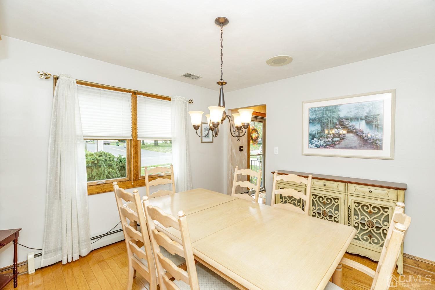 55 Old Post Road Edison, NJ 08817 - Photo 10 of 53 a view of a dining room with furniture window and wooden floor