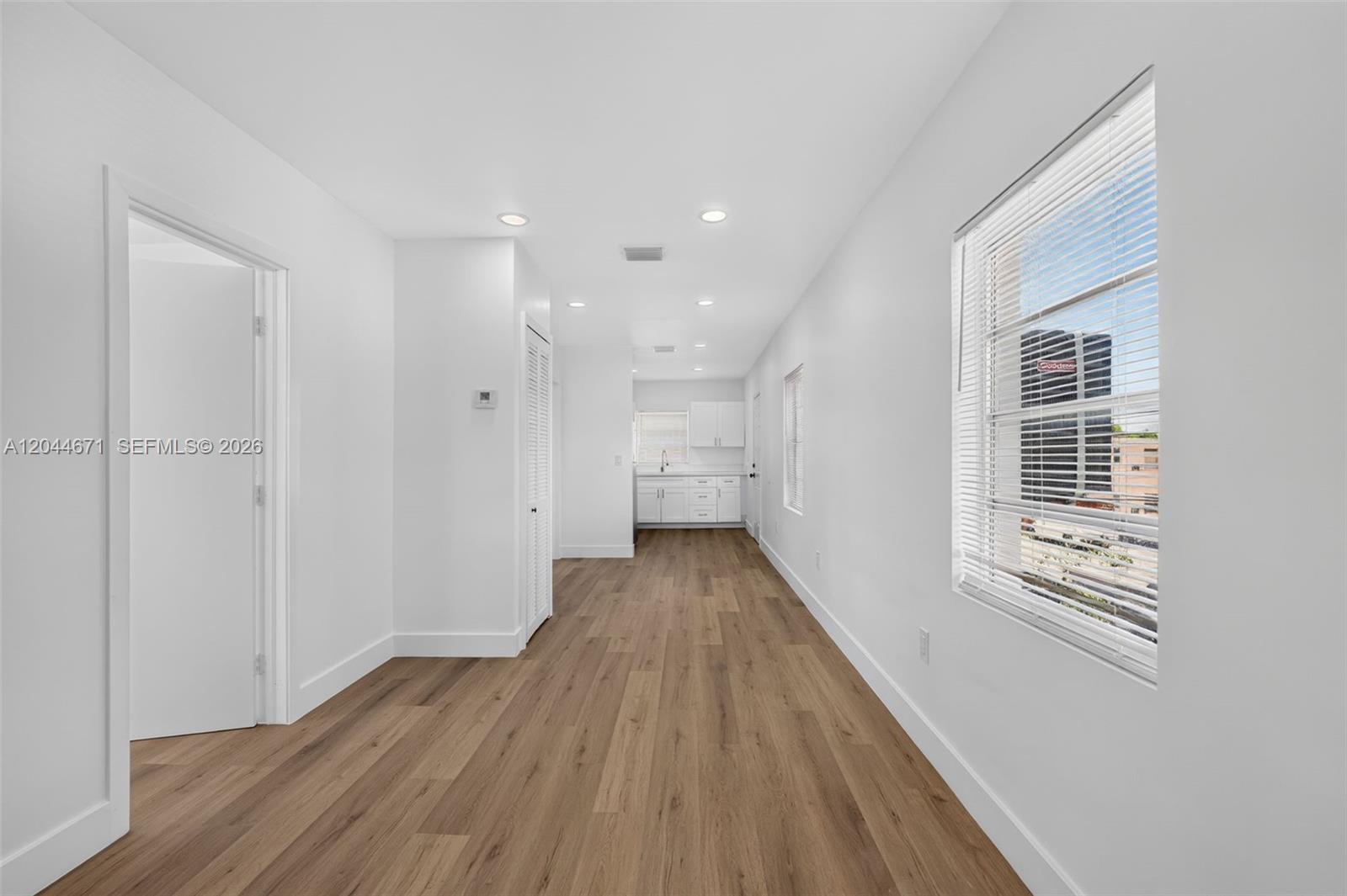 1900 Southwest 6th Street, Unit 6 Miami, FL 33135 - Photo 2 of 20 a view of a house with wooden floor and a window