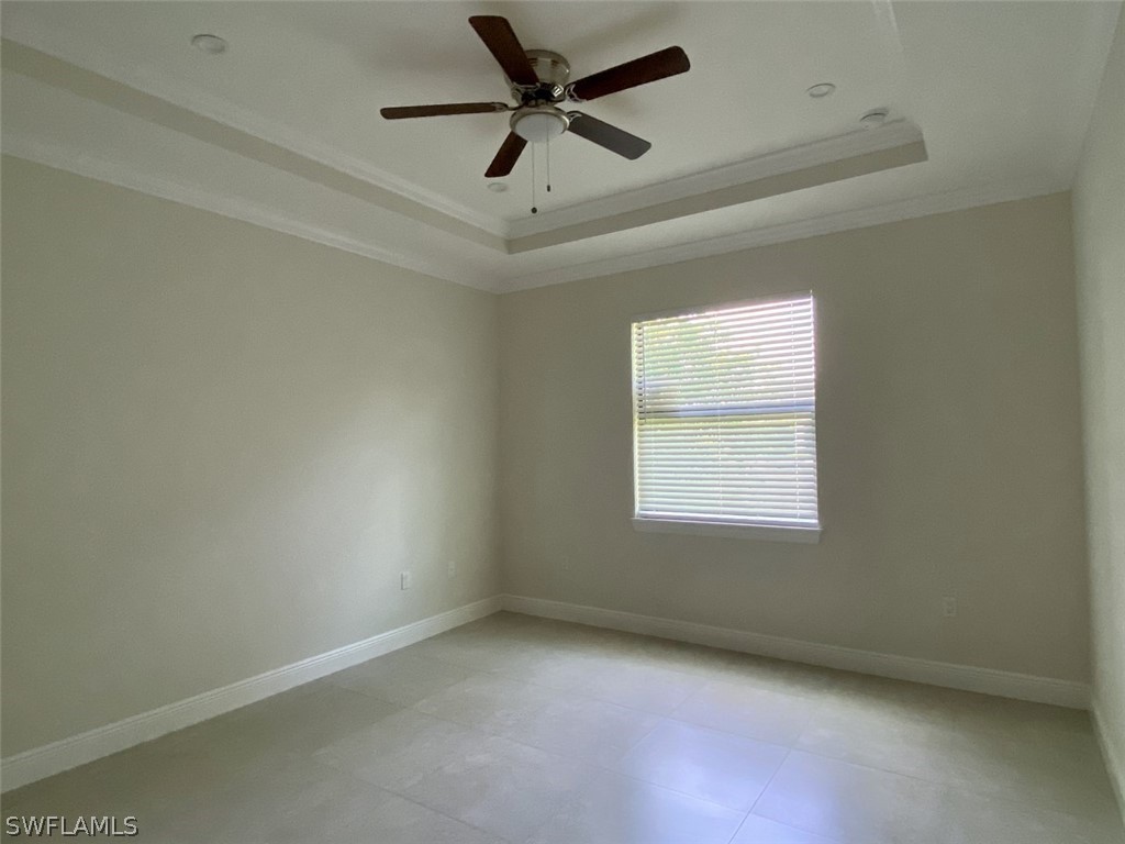7337 Lobelia Road Fort Myers, FL 33967 - Photo 15 of 21 an empty room with a window and a fan