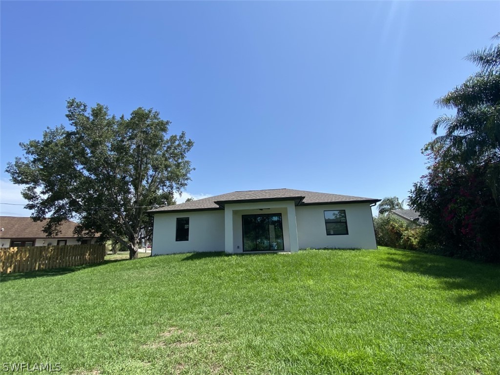 7337 Lobelia Road Fort Myers, FL 33967 - Photo 7 of 21 a view of a house with a yard