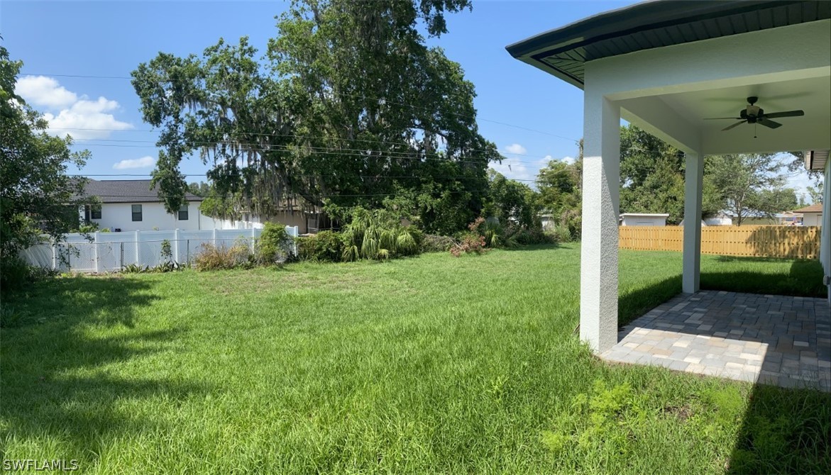 7337 Lobelia Road Fort Myers, FL 33967 - Photo 8 of 21 a view of a yard with plants and large tree