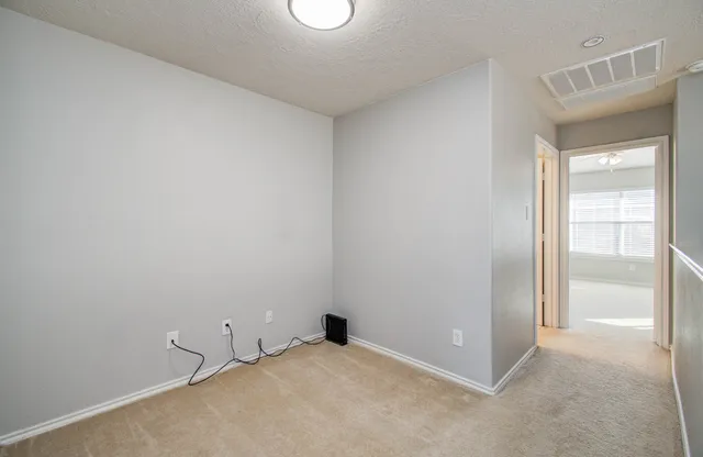 a spacious bathroom with a bathtub shower and a sink