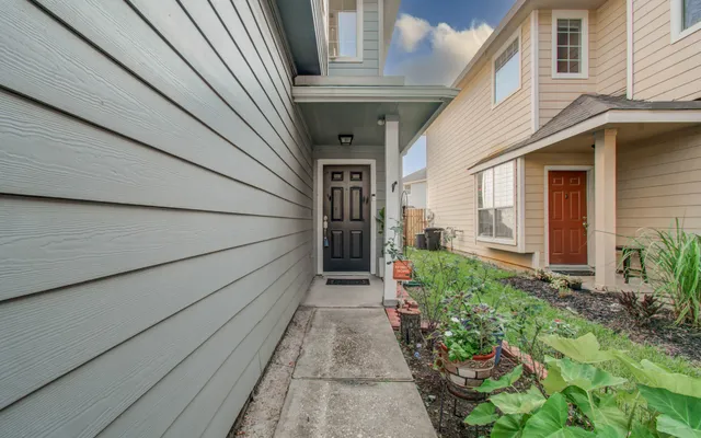 a view of a mirror light fixtures and entryway