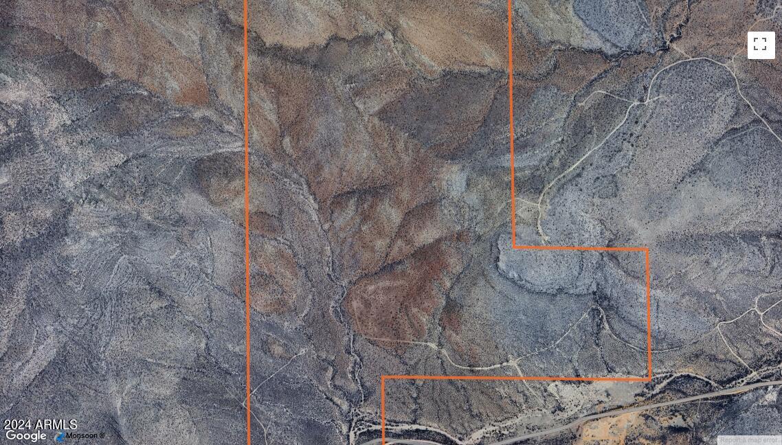 303 Southwest Acres Near Bisbee Road Bisbee, AZ 85603 - Photo 1 of 1 a view of a dry field with trees in the background