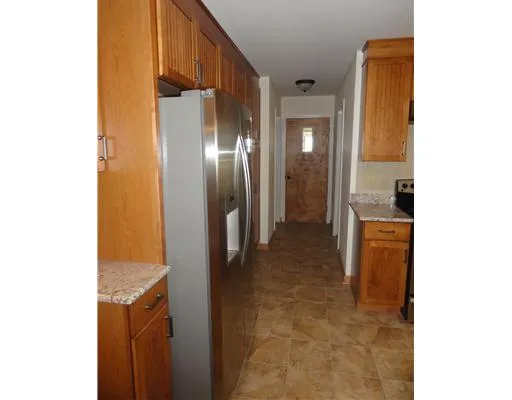 a kitchen with stainless steel appliances granite countertop a sink and cabinets
