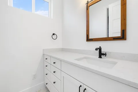 a bathroom with a sink and a mirror