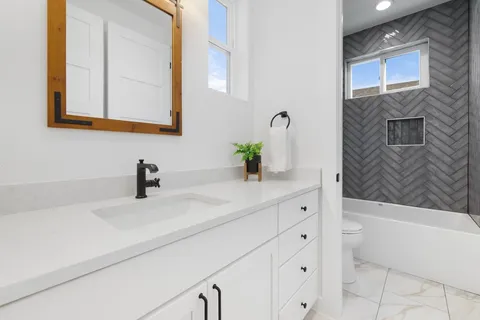 a bathroom with a sink and a bathtub