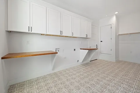 a view of storage and utility room with empty racks