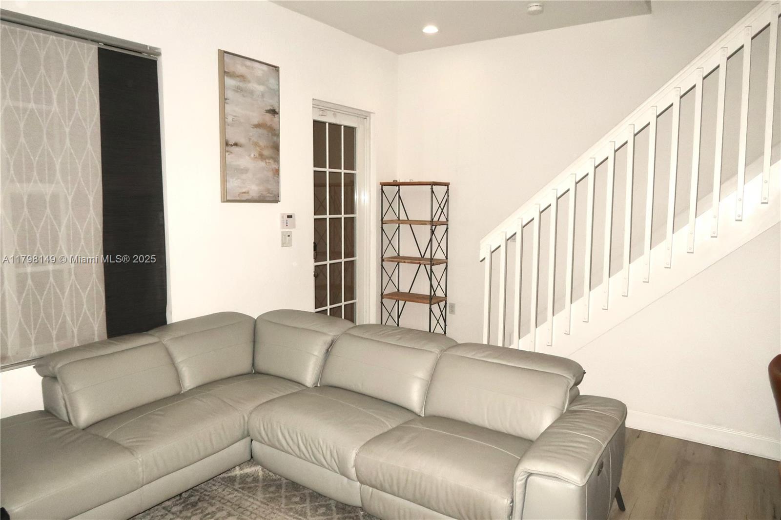 531 Southwest 147th Avenue, Unit 24 Pembroke Pines, FL 33027 - Photo 11 of 16 a living room with furniture and a window