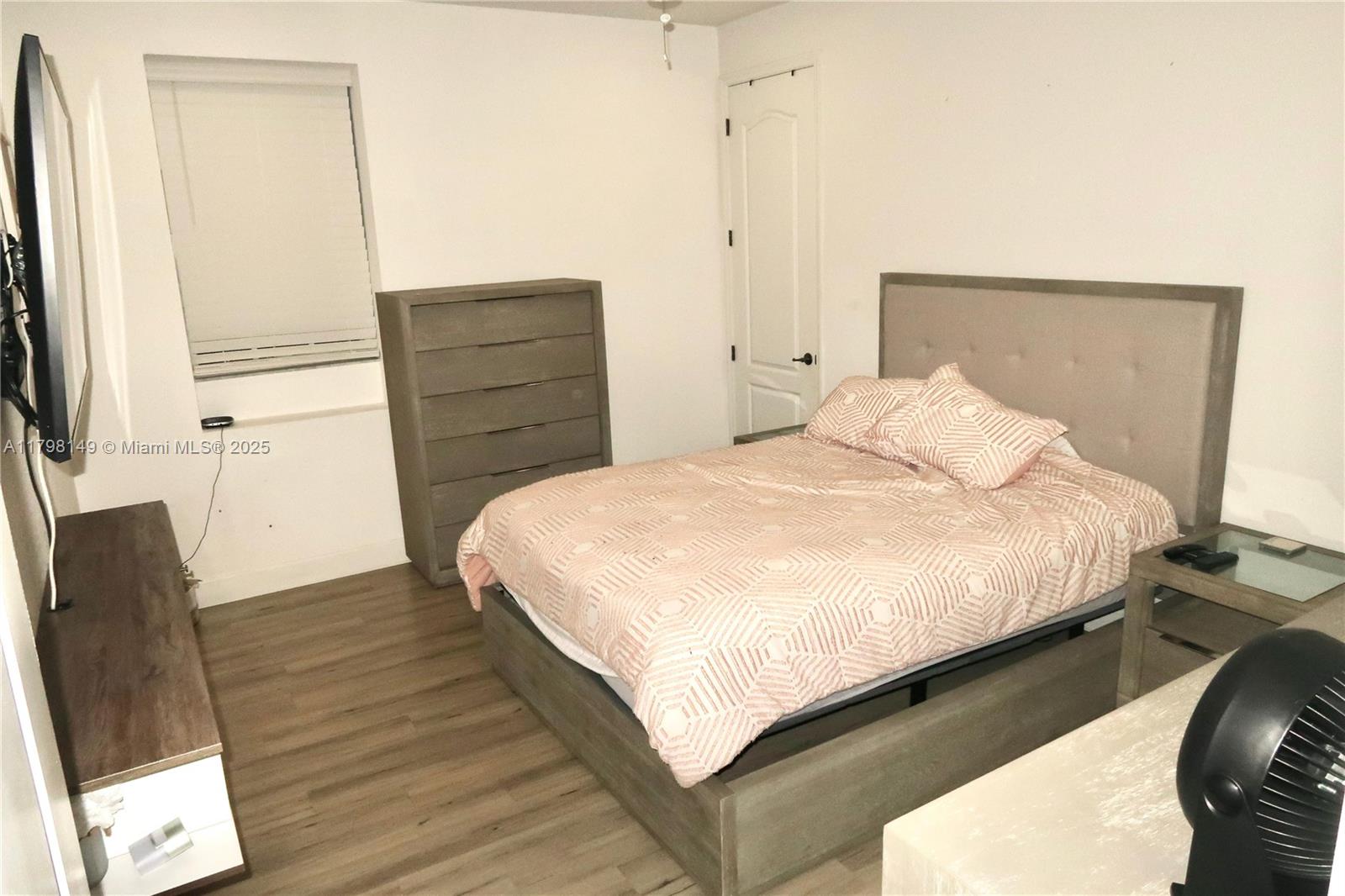 531 Southwest 147th Avenue, Unit 24 Pembroke Pines, FL 33027 - Photo 14 of 16 a bedroom with a bed and furniture