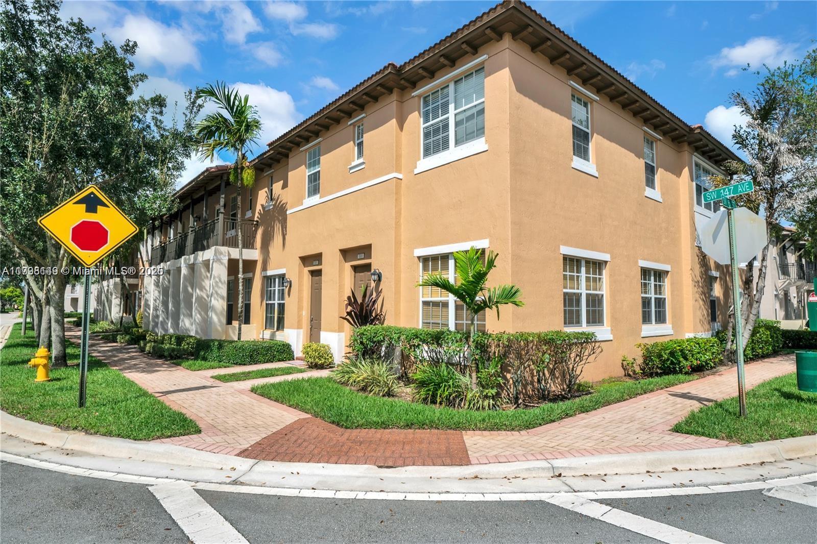 531 Southwest 147th Avenue, Unit 24 Pembroke Pines, FL 33027 - Photo 2 of 16 front view of house with a yard