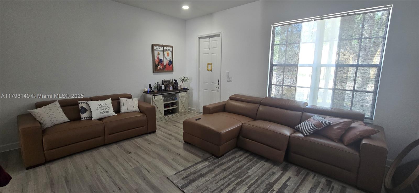 531 Southwest 147th Avenue, Unit 24 Pembroke Pines, FL 33027 - Photo 8 of 16 a living room with furniture and a window