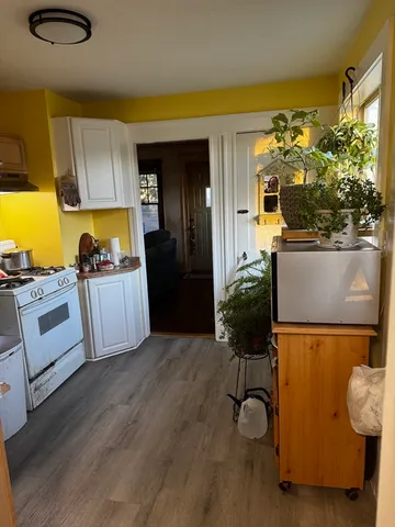 a kitchen with stainless steel appliances granite countertop a refrigerator and a stove