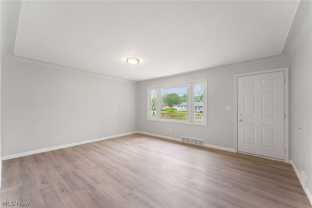 962 Keefer Road Girard, OH 44420 - Photo 5 of 31 Spare room featuring hardwood / wood-style flooring