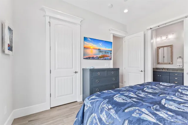 a view of a dining room with furniture wooden floor and chandelier