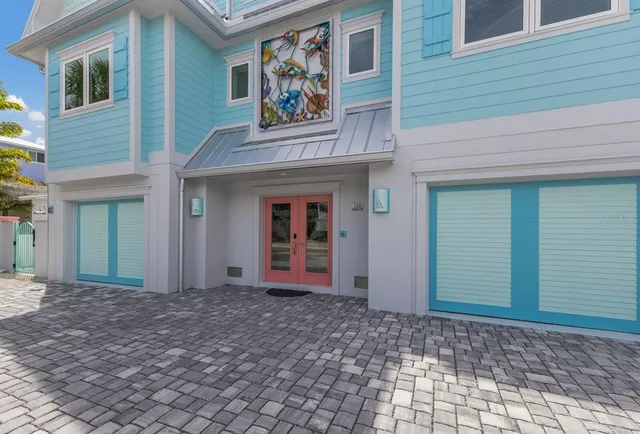 a view of a hallway with wooden floor and stairs